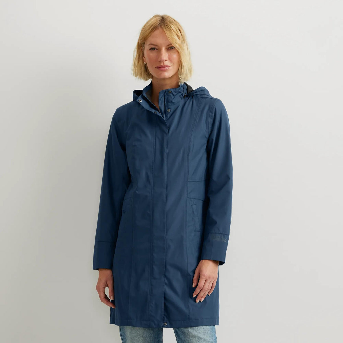 Women's hooded waterproof trench coat with long sleeves and front pockets
