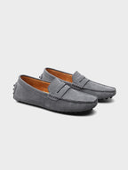 Men's suede boat loafers with rounded moc toe and penny strap detail