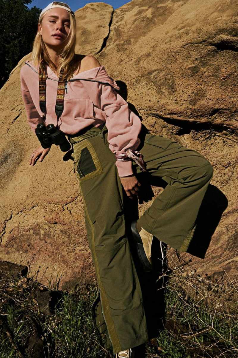 Women's pink hooded half-zip lightweight jacket with kangaroo pocket