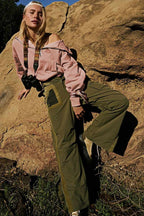 Women's pink hooded half-zip lightweight jacket with kangaroo pocket