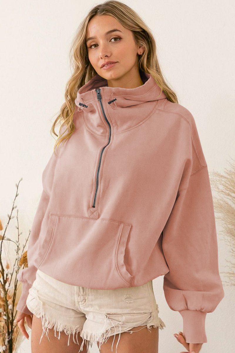 Women's pink hooded half-zip lightweight jacket with kangaroo pocket
