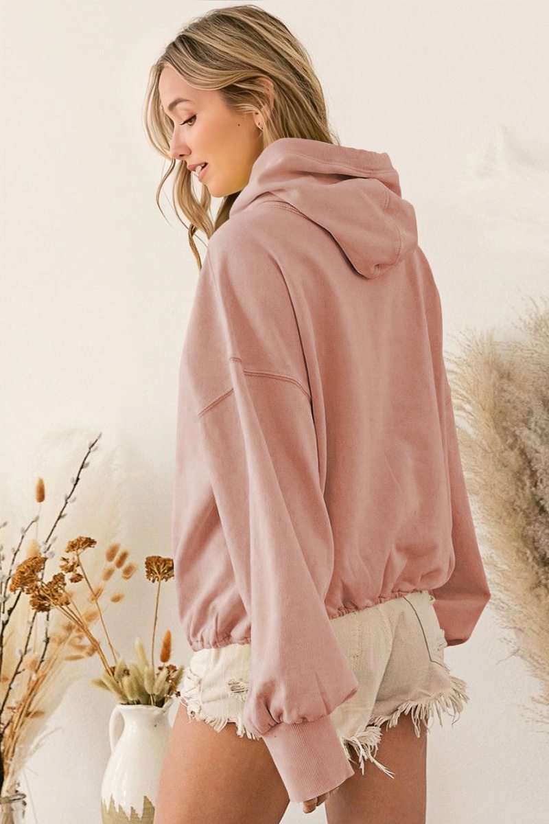 Women's pink hooded half-zip lightweight jacket with kangaroo pocket