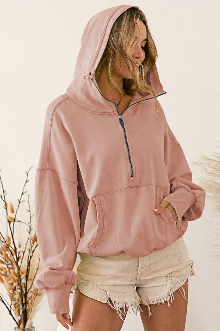 Women's pink hooded half-zip lightweight jacket with kangaroo pocket