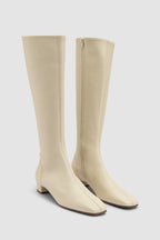 Women's off white knee-high boots with square toe and low block heel