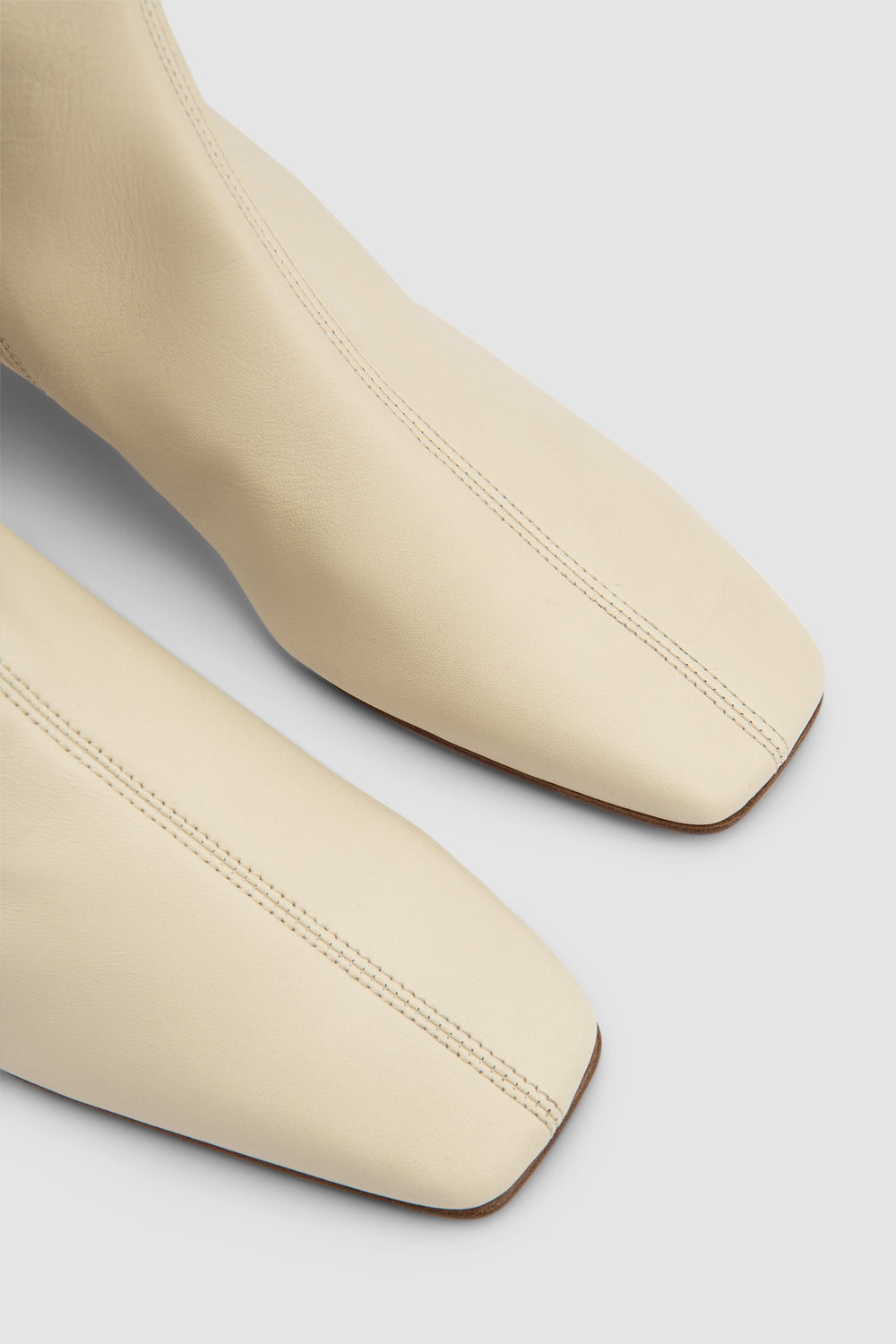 Women's off white knee-high boots with square toe and low block heel