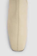 Women's off white knee-high boots with square toe and low block heel