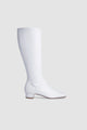 White women's knee-high boots with square toes and low heels