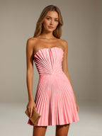 Women's strapless pleated A-line mini dress with a fitted bodice and flared skirt