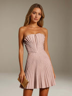Women's strapless pleated A-line mini dress with a fitted bodice and flared skirt