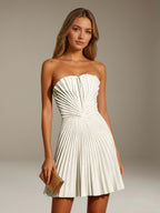 Women's strapless pleated A-line mini dress with a fitted bodice and flared skirt