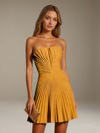 Women's strapless pleated A-line mini dress with a fitted bodice and flared skirt