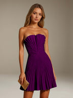 Women's strapless pleated A-line mini dress with a fitted bodice and flared skirt