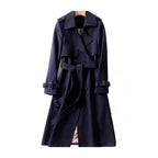 Women's long double-breasted trench coat with belt, shoulder tabs and cuff straps