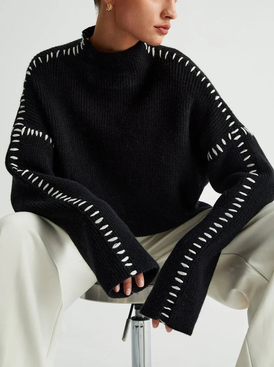 Women's knit sweater with contrast stitch trim and long sleeves