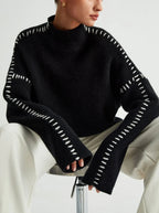 Women's knit sweater with contrast stitch trim and long sleeves