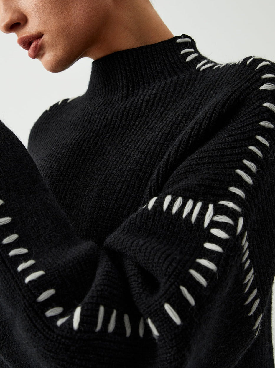 Women's crew neck knit sweater with contrast stitch sleeve details