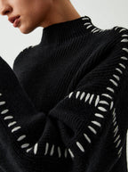 Women's crew neck knit sweater with contrast stitch sleeve details