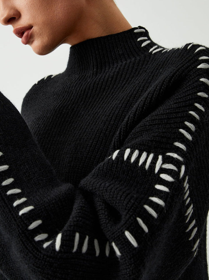 Women's crew neck knit sweater with contrast stitch sleeve details