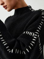 Women's knit sweater with contrast stitch trim and long sleeves