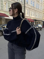 Women's crew neck knit sweater with contrast stitch sleeve details