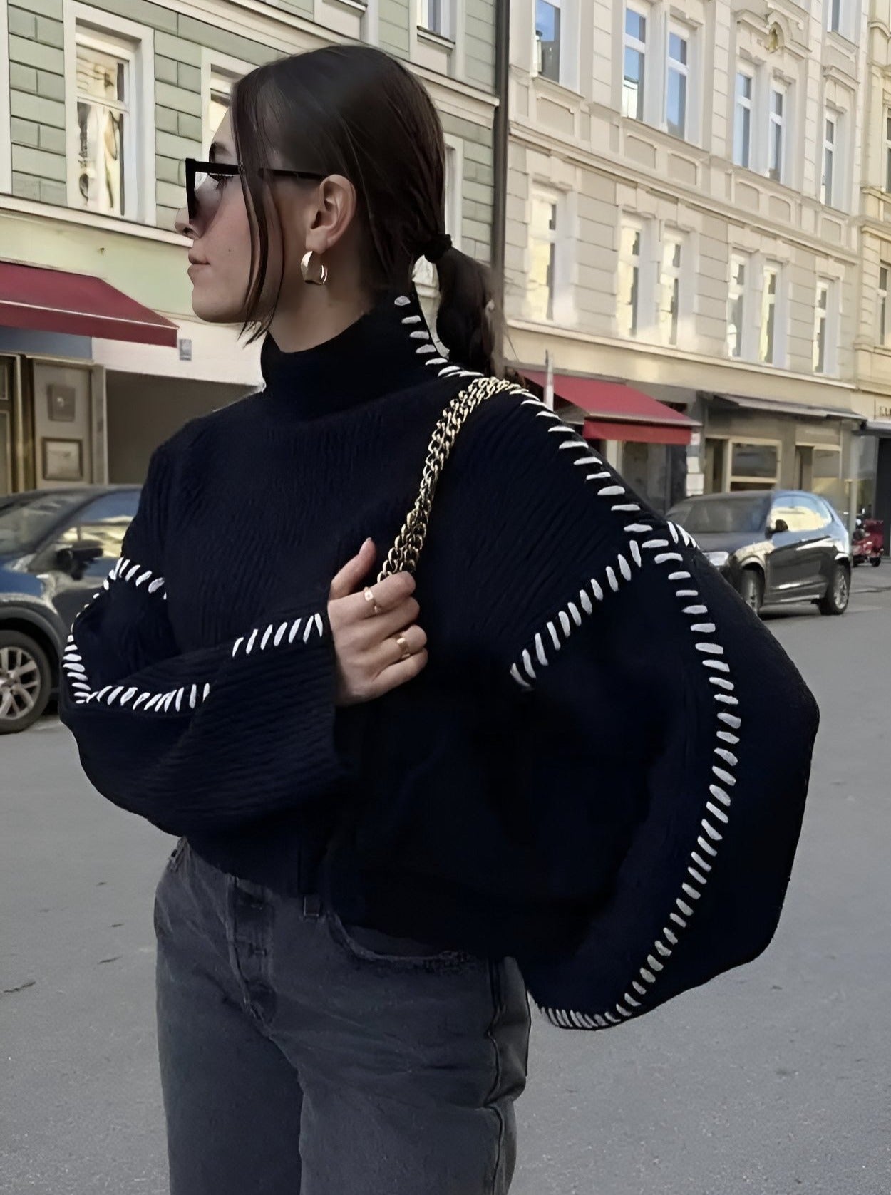 Women's crew neck knit sweater with contrast stitch sleeve details