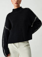 Women's knit sweater with contrast stitch trim and long sleeves