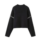 Women's crew neck knit sweater with contrast stitch sleeve details