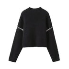 Women's knit sweater with contrast stitch trim and long sleeves