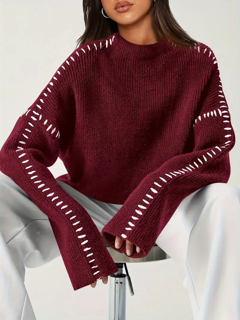 Women's knit sweater with contrast stitch trim and long sleeves