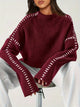 Women's knit sweater with contrast stitch trim and long sleeves