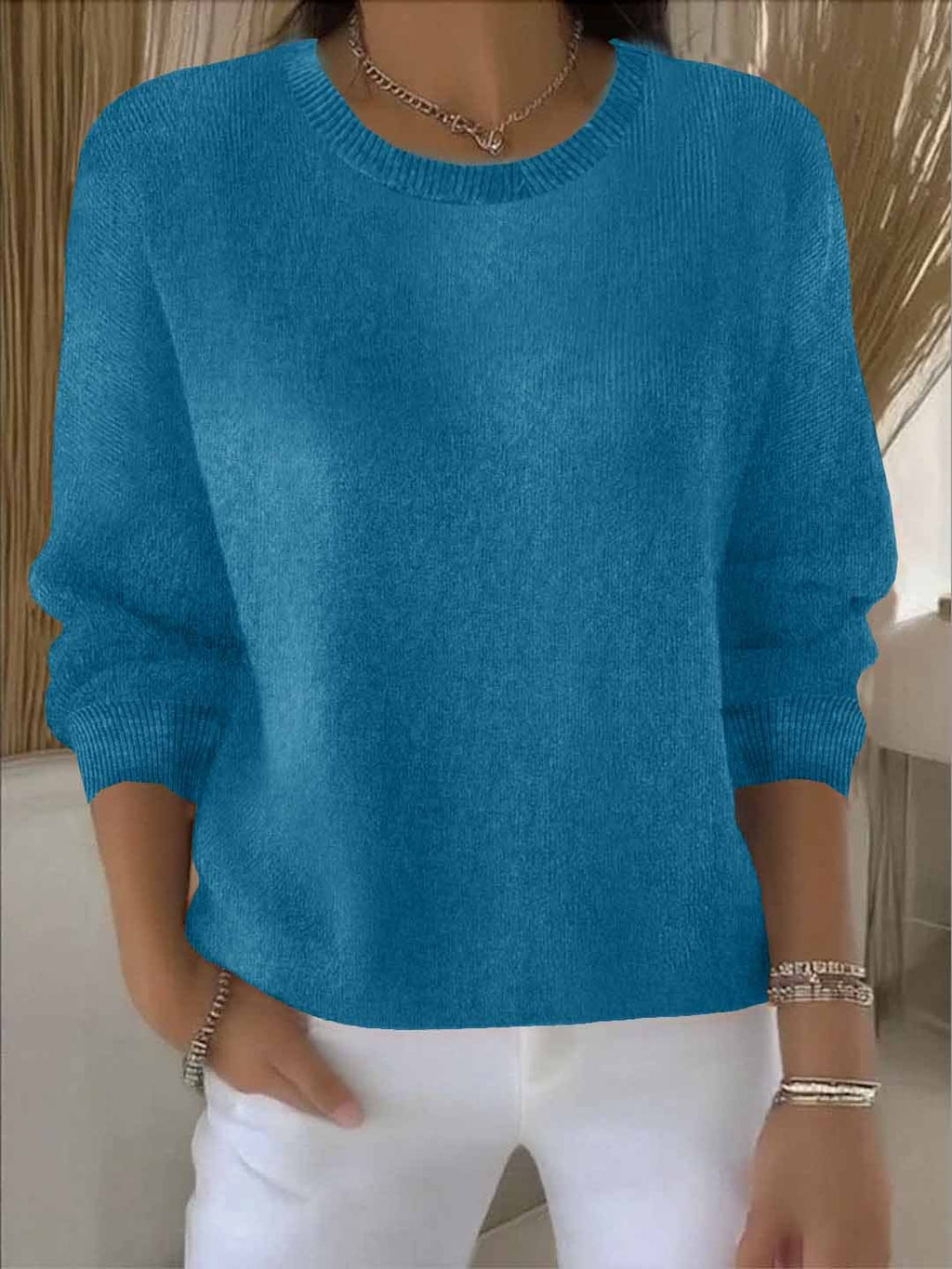 Women's crew neck knitted sweater with long sleeves and ribbed trims