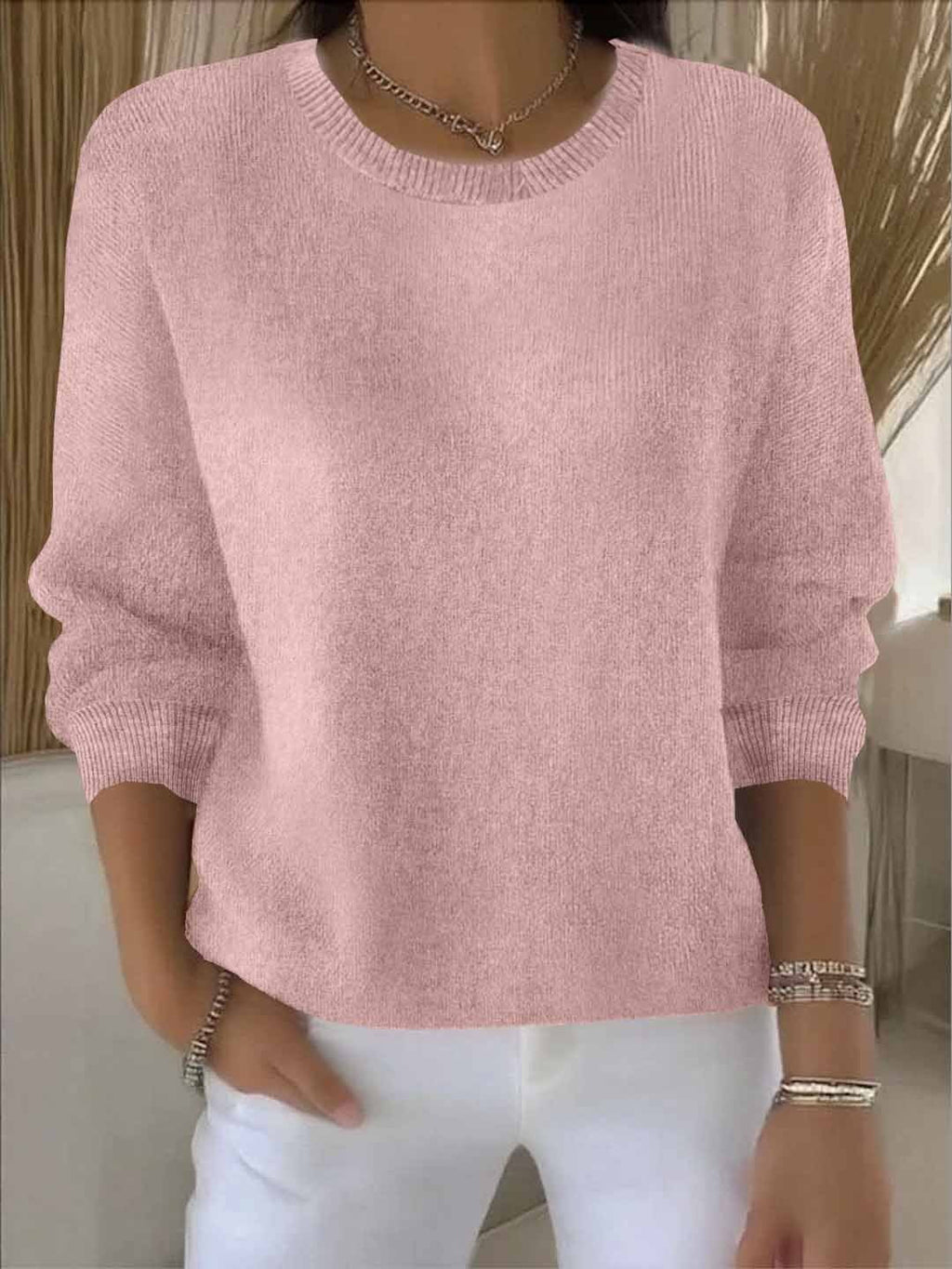 Women's crew neck knitted sweater with long sleeves and ribbed trims