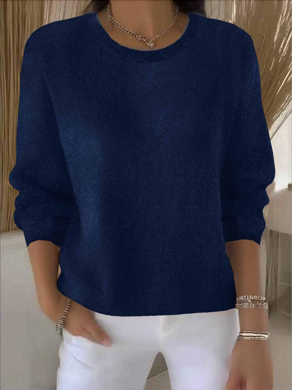 Women's crew neck knitted sweater with long sleeves and ribbed trims