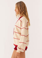 Women's ivory and red striped V-neck cardigan with button front