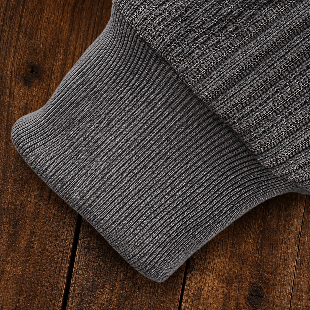 Men's textured polo sweater with collared neckline, buttons and long sleeves
