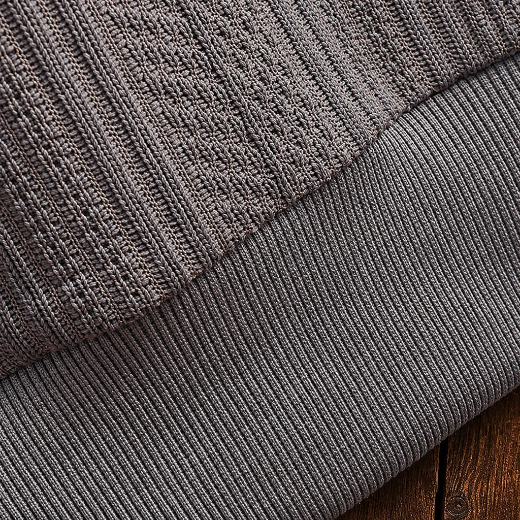 Men's textured polo sweater with collared neckline, buttons and long sleeves