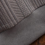 Men's textured polo sweater with collared neckline, buttons and long sleeves