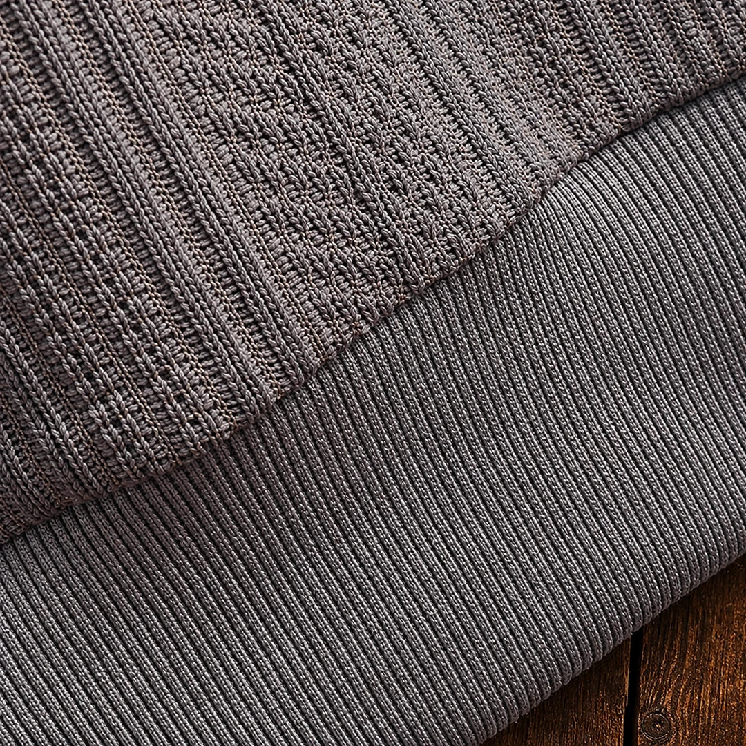 Men's textured polo sweater with collared neckline, buttons and long sleeves