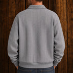 Men's textured polo sweater with collared neckline, buttons and long sleeves