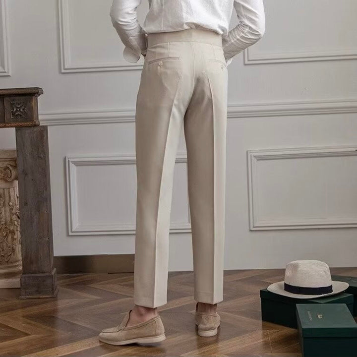 Women's high-waisted pleated straight-leg trousers shown in beige and black
