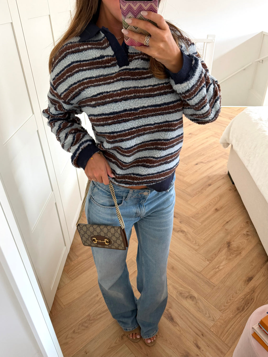 Women's textured striped sweater with collared V-neck and long sleeves