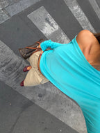Women's blue asymmetric long sleeve top worn off one shoulder