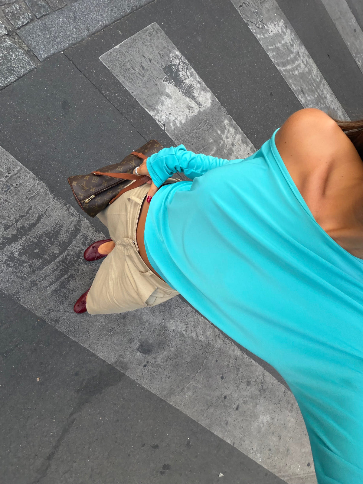 Women's blue asymmetric long sleeve top worn off one shoulder