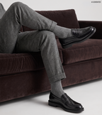 Men's black polished penny loafers with rounded toes and low block heels