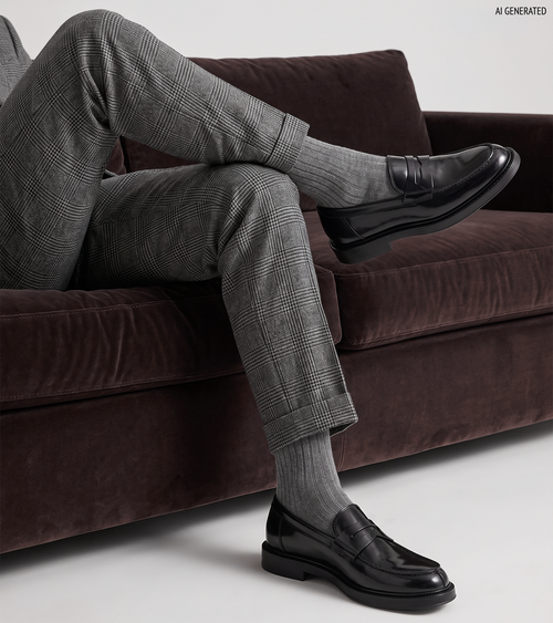 Men's black polished penny loafers with rounded toes and low block heels