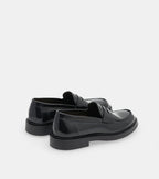 Men's black polished penny loafers with rounded toes and low block heels