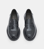 Men's black polished penny loafers with rounded toes and low block heels