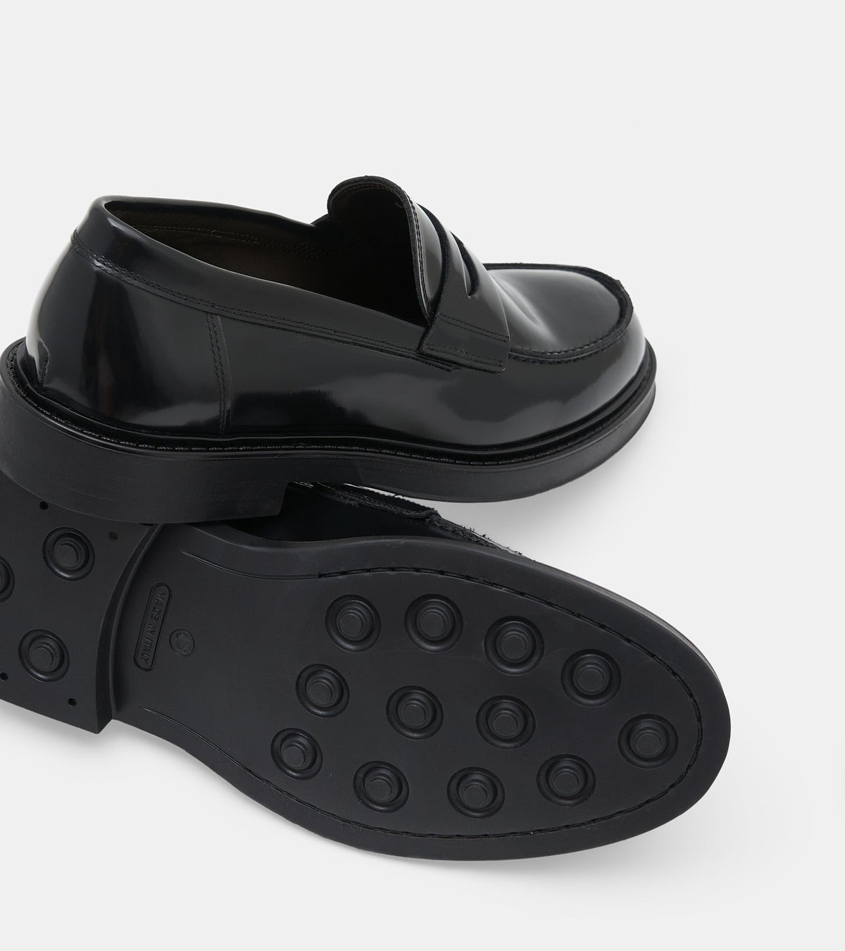 Men's black polished penny loafers with rounded toes and low block heels