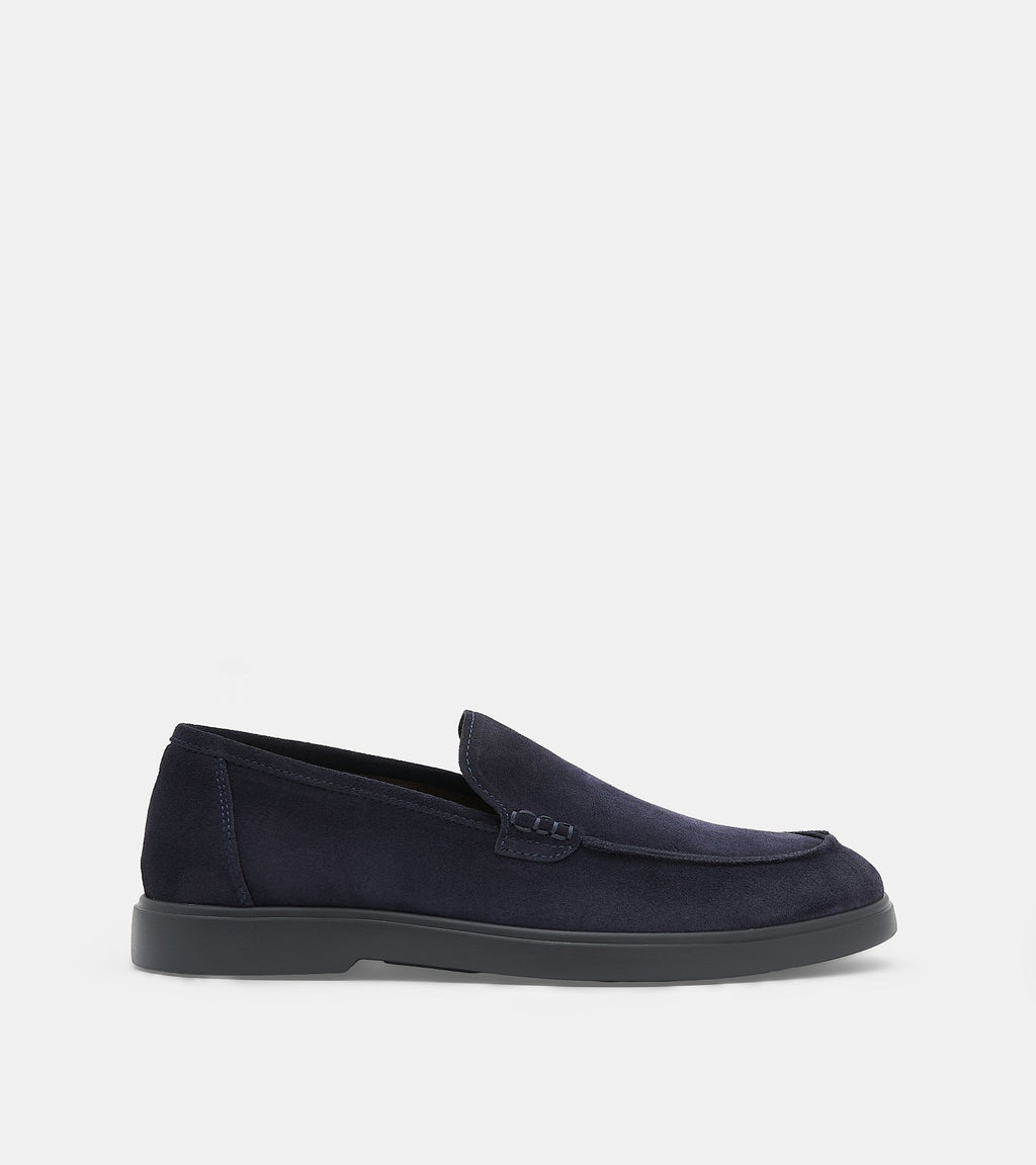 Men's navy slip-on loafers with almond toes and flat soles