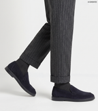 Men's navy slip-on loafers with almond toes and flat soles